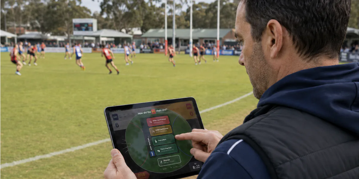 A volunteer captures chains of possession on an iPad from the boundary line